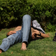 A man lies on the grass amid intense temperatures in Madrid on May 19, 2022.